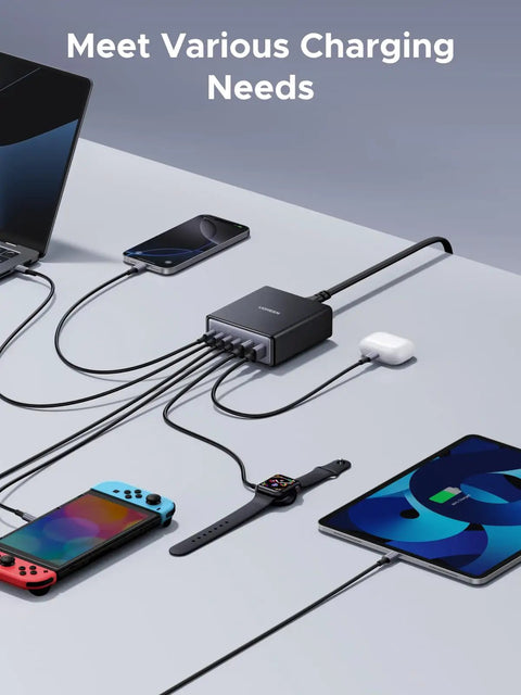 Six Port GaN Desktop Charger With 100W USB C Power Hub charging multiple devices on a desk.