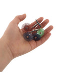 Hand holding assorted Radial Bristle Discs for 3Mm Shank Kit with colorful spiral flap wheels and abrasive materials.