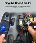 Connecting 2.4GHz RC Controller 4CH Remote with Receiver in RC Car, close-up view showcasing setup process.