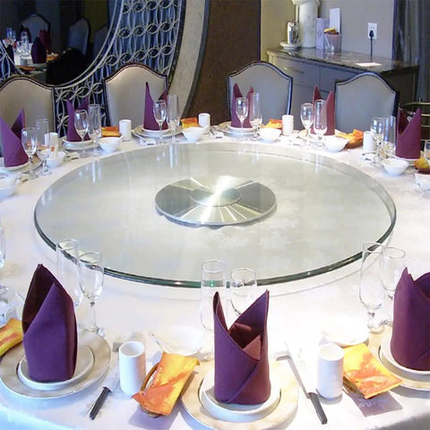 Elegant dining setup with Clear Glass Rotating Tray For Dining And Decor, 360 Degree Turntable Lazy Susan, Round Serving Plate.