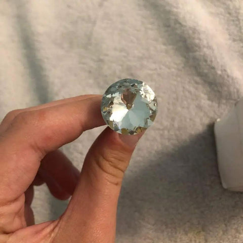 A Total Knockout Thirty Piece Set Of Twenty Five Millimeter Diamond Crystal Upholstery Tacks With Silver Plated Nails For Sofas Headboards And Furniture Crafts Diy Projects That Bring Serious Swagger To Your Space held in hand.