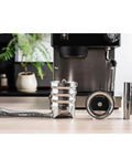 Premium Retractable Espresso WDT Tool All Stainless Steel Coffee Distribution Needle on wood surface with espresso machine.