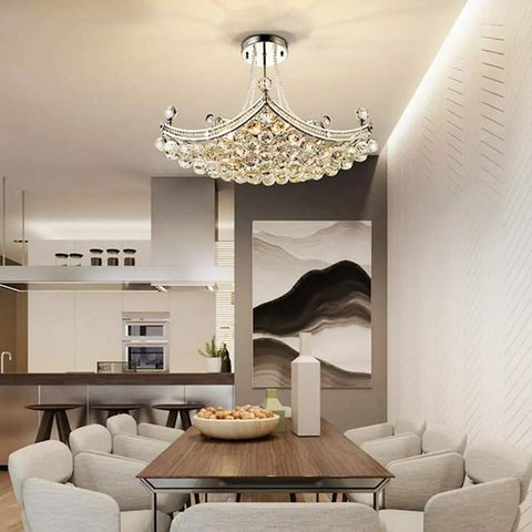 Modern Crystal Chandelier Pendant Light With Silver Finish, 25 Inch Ceiling Fixture above dining table in elegant room
