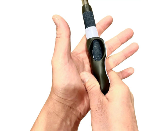 Left Handed Golf Grip Trainer Golf Swing Aid Attachment in hand, showing grip correction tool on a standard golf club shaft.