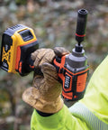 Person using 20V Battery Powered Impact Driver With One Quarter Inch Hex Quick Connect 210 Foot Pounds Max Torque Brushless Motor