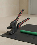 Ratcheting Tube Cutter For PVC Tubing Beastly Heavy Duty Aluminum Pipe Shear with green tube on tile floor