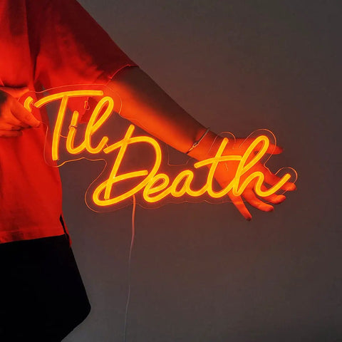 Person holding Til Death Neon Light Sign USB Powered LED Decor For Halloween Weddings Parties And Bridal Showers 17 Inch Orange Bedroom Wall Decor With On Off Switch 5V Dope Vibe