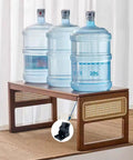 Three water jugs on a table supported by Two Pack 90 Degree Self-Locking Folding Hinge Lock Steel Foldable Bracket Hidden Hinge.