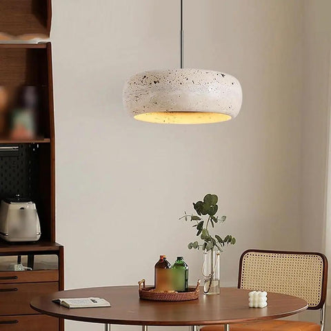 Modern Dome Yellow Travertine Pendant Light, spherical design in natural stone above a dining table setting.