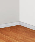 Peel And Stick 3D Crown Molding Foam Wall Border Self Adhesive Baseboard Trim White 2 Pack installed on white wall and wood floor corner