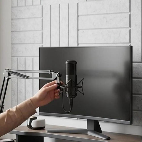Premium Slick Self Adhesive Foam Panels 12 Pack Acoustic Wall Tiles For Soundproofing, gray tiles behind a microphone and monitor setup.