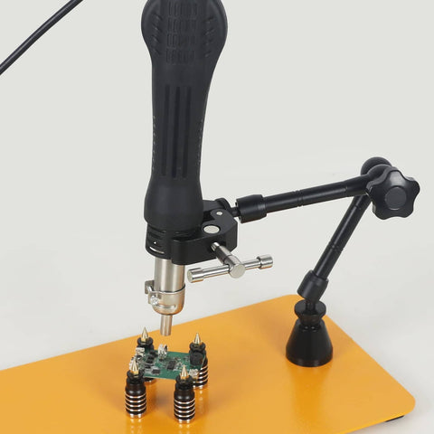 Close-up of Helping Hands Soldering Third Hand With 3X And 6X LED Magnifying Lamp Hot Air Gun Holder on orange base with PCB clamp
