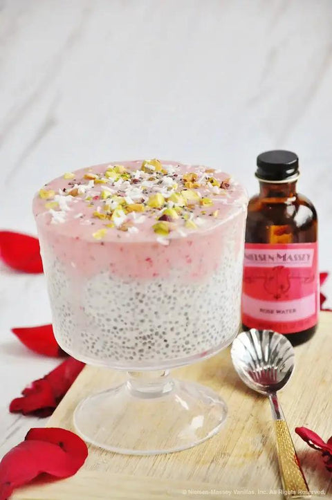 Rose Water For Baking Cooking And Drinks Pure Floral Flavor 18 Ounce Bottle with dessert topped with pistachios