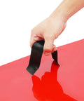 Hand holding a handle attached to a 4 Piece Concrete Stamps Mats Set 24x24 With Handle Realistic Texture Mats For Walls Floors And Patios Durable PU Material