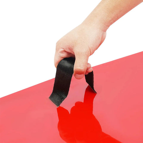 Hand holding a handle attached to a 4 Piece Concrete Stamps Mats Set 24x24 With Handle Realistic Texture Mats For Walls Floors And Patios Durable PU Material