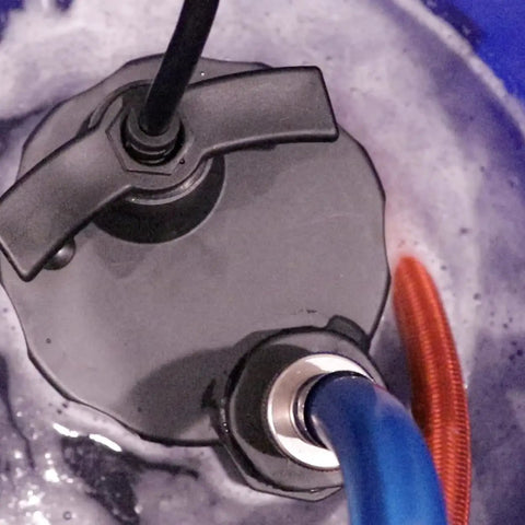 Top view of 1/6 HP pump with dual steel hoses in 3.5 gallon bucket from Tankless Water Heater Descaler Kit With 3.5 Gallon Bucket, 1/6 HP Pump, And Dual Steel Hoses Just Add Vinegar Or Your Own Descaler For Quick, Easy Flushes And Extended System Life.