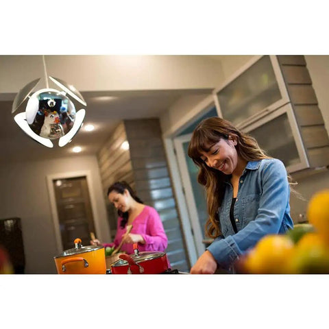 Two women cooking under lighting with Exceptional Series A19 Dimmable LED Bulb 2700K Soft White, 1100 Lumens, 75W Equivalent