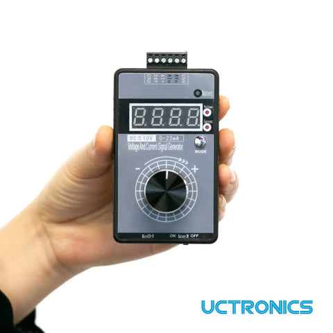 Hand holding a DC Plus Or Minus Ten Volt Output And Four To Twenty Milliamp Current Loop Signal Generator With USB Power.