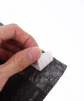 Hand sealing a Padded Bubble Mailers Self Seal Envelopes 12x18 And 4 Inch Thickened Black Shipping Bags 100 Pack for small biz