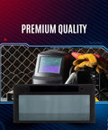 Auto Darkening Welding Lens 2x4 Shade 9 with High Definition Clarity in front of helmet, gloves, and equipment
