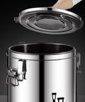 Drop Dead Solid 100 Liter Stainless Steel Storage Bin With No Sweat Airtight Lid, shown with lid opening, ideal for pet food and dry goods.