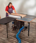 Folding Table Saw Outfeed Kit With Adjustable Height Legs And Foldable Steel Frame For Easy Storage in workshop setup.