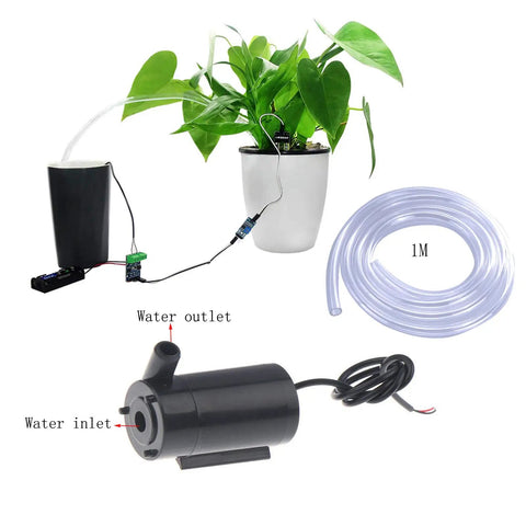 4 Pack Dope Submersible Mini Water Pumps With Clear 1m Tubing For Aquariums And Fountains, shown with plant setup.