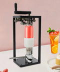 Top Shelf Manual Jar Sealer For 55Mm Soda Pots With Heavy Steel Build and Smooth Rotary Winder in use.