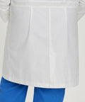 Back view of Relaxed Fit Five Pocket Three Button Full Length White Medical Lab Coat For Women with blue scrubs.