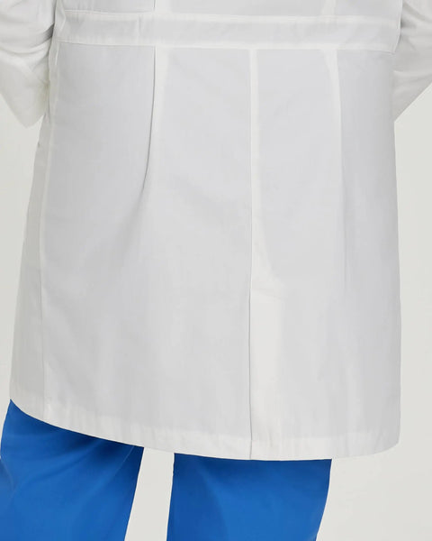 Back view of Relaxed Fit Five Pocket Three Button Full Length White Medical Lab Coat For Women with blue scrubs.