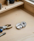 4 Pack Concealed Cabinet Hinges, Zinc Alloy 90 Degree Flip Design With Silent Opening, Hidden Mount on a wooden workbench