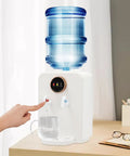 No Fuss Countertop Water Dispenser With Hot And Cold Water, white, top loading, dispensing into a glass, on a kitchen counter
