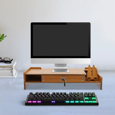 Transform Your Workspace With These Solid Wood Monitor Risers Featuring A Lockable Storage Drawer With Secure Laptop Stand Built Like Iron. Wooden monitor riser with drawer, computer standing, and keyboard.