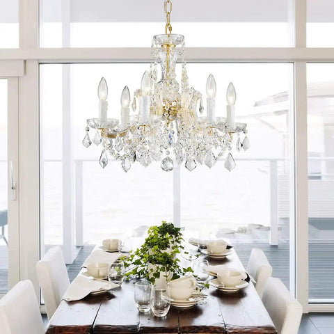 Modern Crystal Chandelier Light Fixture With Six Lights, Raindrop Pendant Crystals In Maria Theresa Brass Finish over dining table
