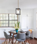 Dining area with One Light Lantern Pendant with adjustable stem, black and brushed brass, clear glass cage shade, rustic vibe