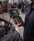 Mechanic using Clear View Borescope With 2.4 Inch LCD Screen And 8.5mm Waterproof Camera 38 Inch Flexible Cable for engine check