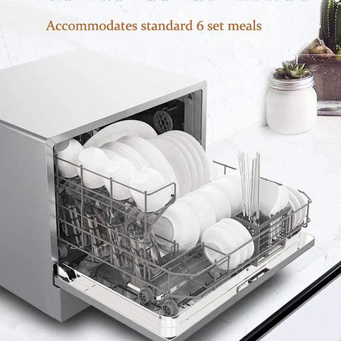 Portable Countertop Dishwasher With Five Automated Wash Cycles And Six Place Settings Featuring One Touch Auto Clean Mode, loaded with plates in stainless rack.