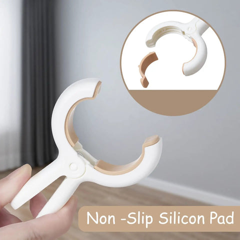 Close-up of a 12 Pack Heavy Duty Plastic Clothes Pins Featuring Anti Rust Springs And Non Slip Silicone Pads showing grip pad.