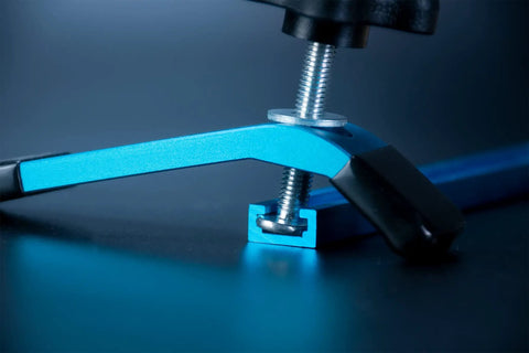 Close-up of Blue T Track Clamps For Woodworking Set Of 4 Hold Down Clamps With 5 Inch Length And T Slot Bolts in action.