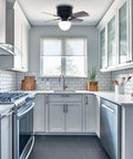 30 Inch Hugger Ceiling Fan With Pull Chain Low Profile Flush Mount Reversible Blades Matte Black in a modern kitchen.
