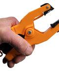 Close-up of a hand holding a clamp included with the Type K Dual Channel Digital Thermometer For Pipe Temperature