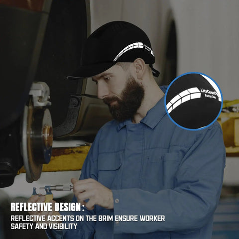 Mechanic wearing Lightweight Bump Cap With Breathable Baseball Cap Style For Head Protection On The Job For Men And Women Black Finish Featuring A Durable ABS Liner Seamless Comfort And All Day Airflow, with reflective accents.