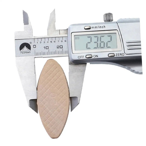 100 Pcs Wood Biscuit Tenon Joiner Tool shown with digital caliper measuring 23.62mm, ideal for thin materials under 15mm