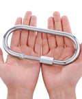 Person holding Big Oval Locking Carabiner Clip 6 Inch M10 Quick Link For Trailer Tow Chains Ropes Cables And Hammocks Outdoor Camping Gear