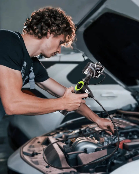 Mechanic using 360 Degree Four Way Articulating Borescope With Tiny 0.26 Inch Probe Pro Grade Endoscope in car engine