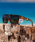 ANSI Z87+ Safety Sunglasses Packing Polarized Lenses To Vaporize Glare For Work, Surf, And PPE Missions on a wooden surface.