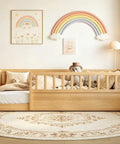 Twin Floor Bed With High Safety Fence, Solid Pine Wood Montessori Toddler Sleep Platform, Natural Finish Wooden Frame For Nursery And Kids Room, Seriously Sturdy Setup in a cozy nursery setting.