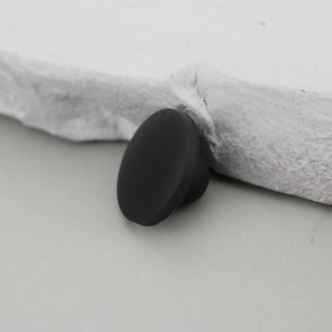 Close-up of a black knurled bumper for 1/4 inch holes, 100x Rubber Feet Push In Knurled Bumpers For 1/4 Inch Holes, No Tools Needed Press Fit