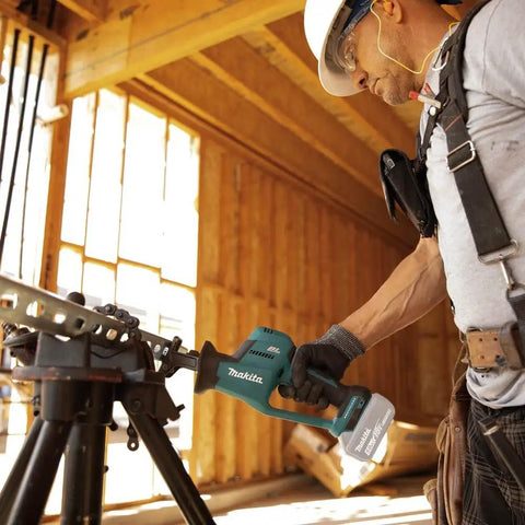 Worker using XRJ08Z 18V LXT Brushless Cordless Compact One-Handed Reciprocating Saw Tool Only for fast cuts on metal pipe