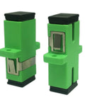 Angled view of two green SC fiber optic adapters (female-to-female) with metal contacts for panel-mount use
